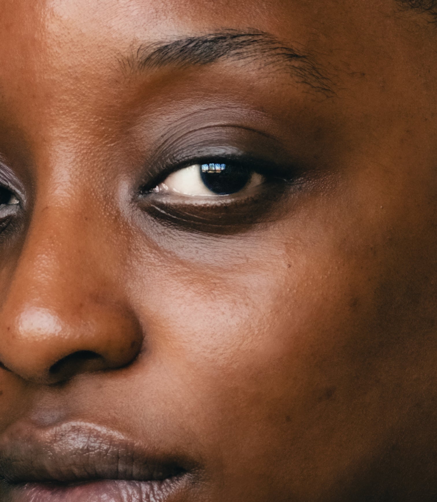 Close-up of a person's eye with a neutral expression