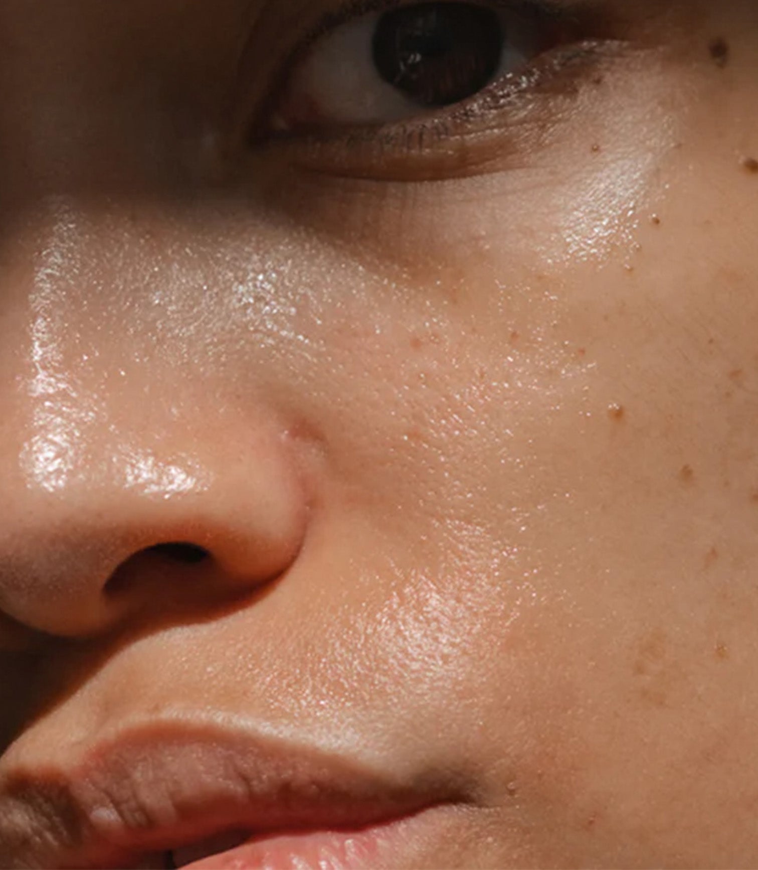 Close-up of a person's nose and mouth area with skin texture visible