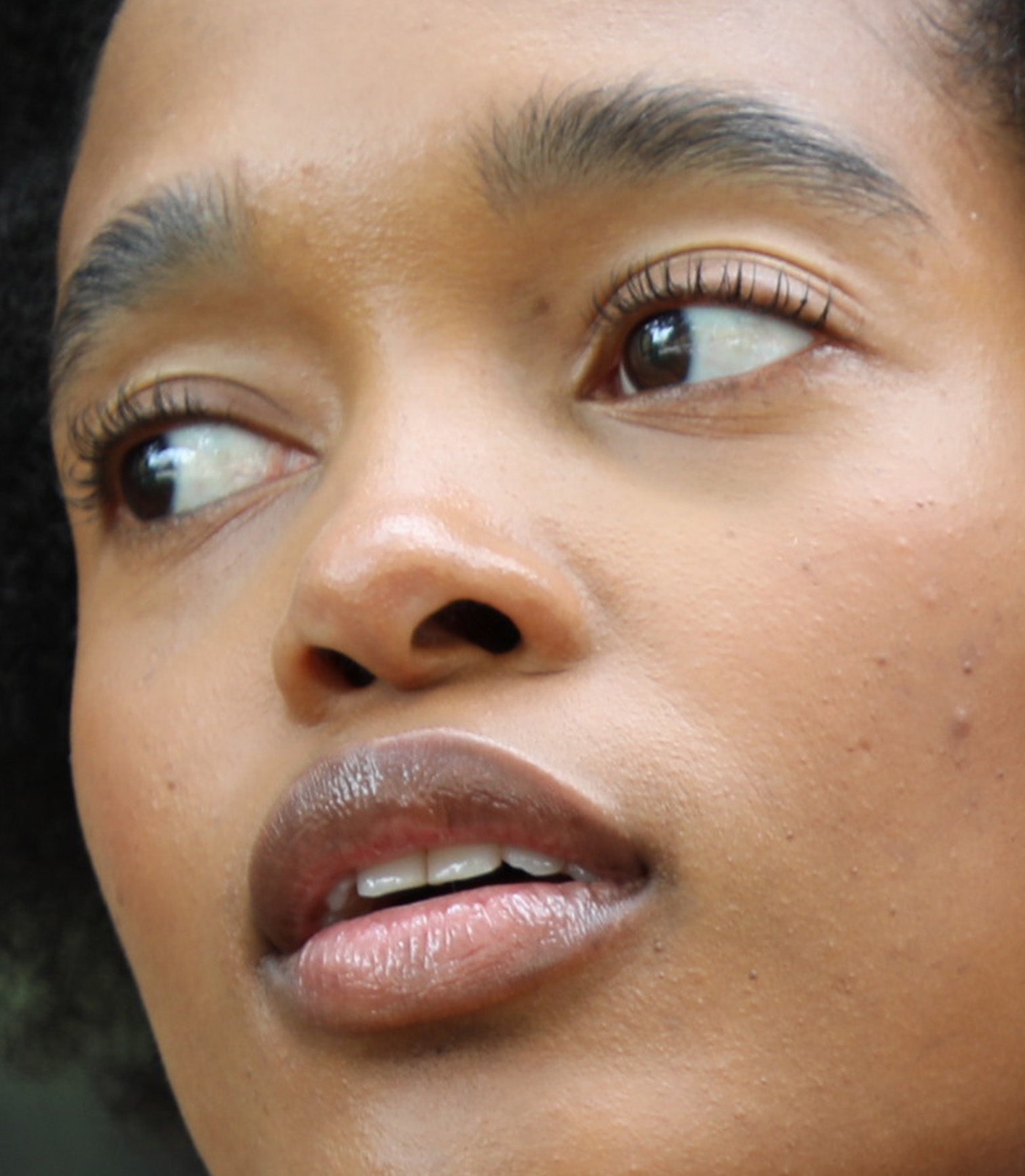 Close-up of a person's face with a blurred background